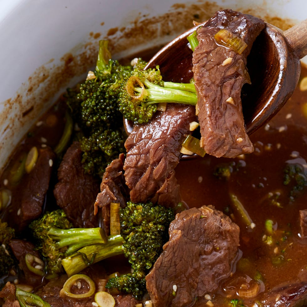 beef and broccoli in a white slow cooker