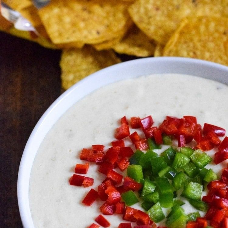 https://hips.hearstapps.com/hmg-prod/images/slow-cooker-dips-salsa-verde-queso-6598b31912c04.jpeg?crop=1.00xw:0.667xh;0,0.221xh&resize=980:*