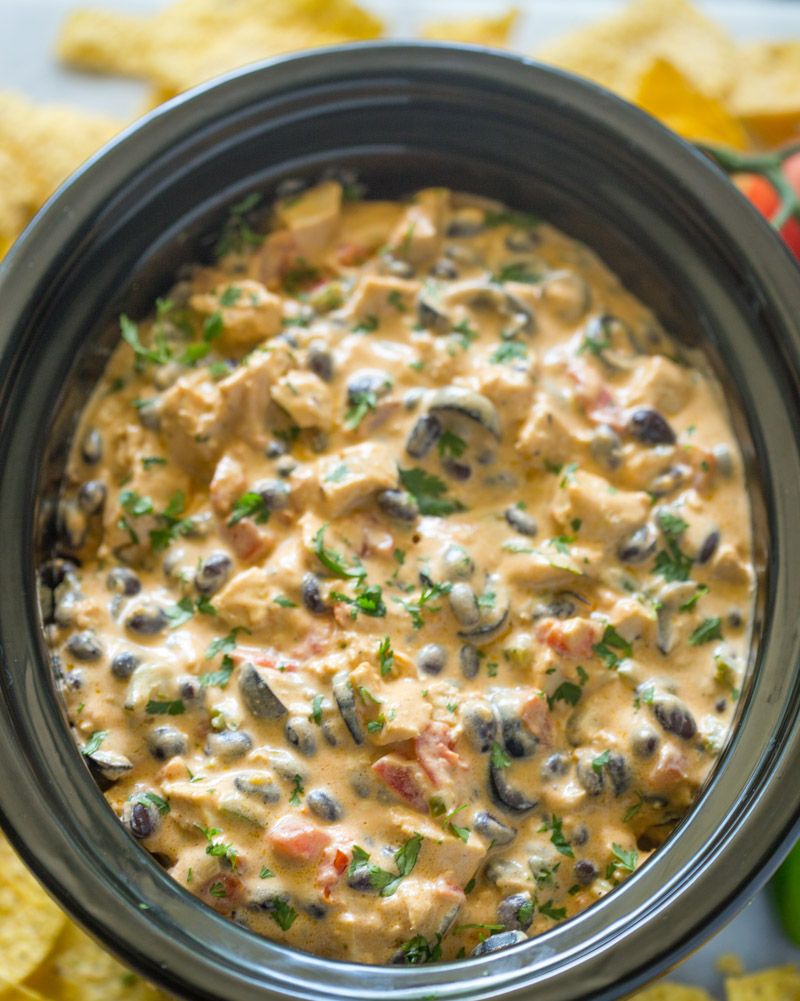 https://hips.hearstapps.com/hmg-prod/images/slow-cooker-dips-slow-cooker-queso-chicken-dip-1638401039.jpeg?crop=1.00xw:0.894xh;0,0.0960xh&resize=980:*