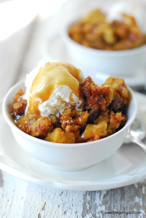pumpkin pecan bread pudding in white cup with ice cream