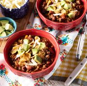 slow cooker turkey chili with avocado cheese and corn chips