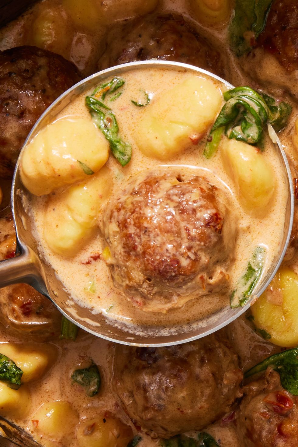 chicken meatballs and gnocchi in a creamy tuscan sauce