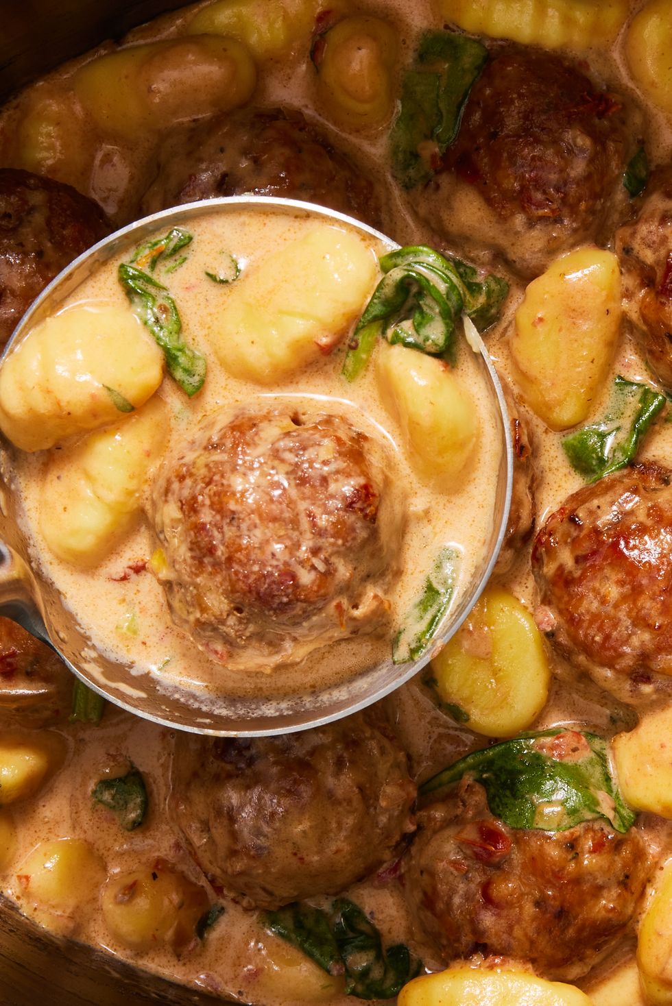 https://hips.hearstapps.com/hmg-prod/images/slow-cooker-tuscan-chicken-meatballs-with-gnocchi-vertical-2-64665b26f1d26.jpg?crop=0.834xw:1.00xh;0.0308xw,0&resize=980:*