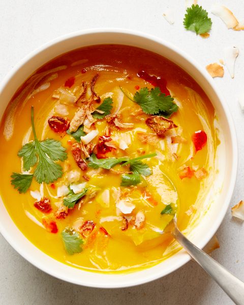 slowcooker vegan butternut squash soup garnished with coconut milk and cilantro