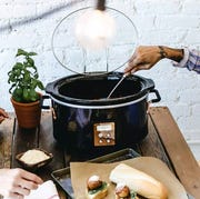 women using a crux slow cooker to make meatballs women using a crux slow cooker to make meatballs