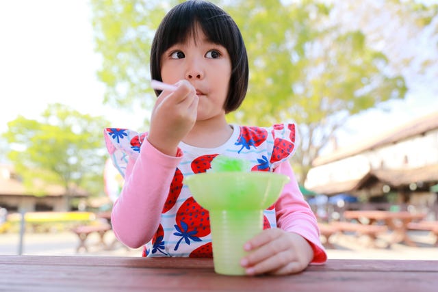 little girl enjoy melon flavored shaved ice spring season activities