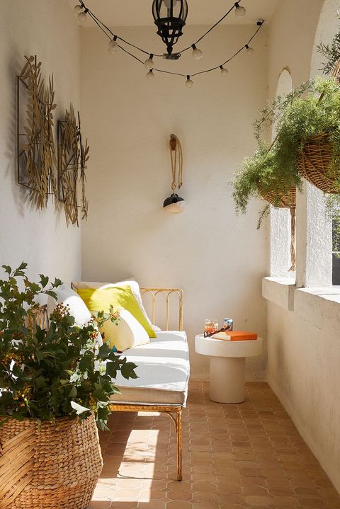small boho balcony with hanging plants