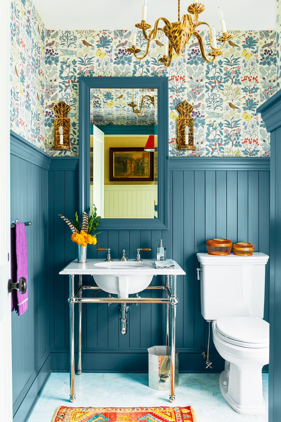 small blue bathroom with paneling