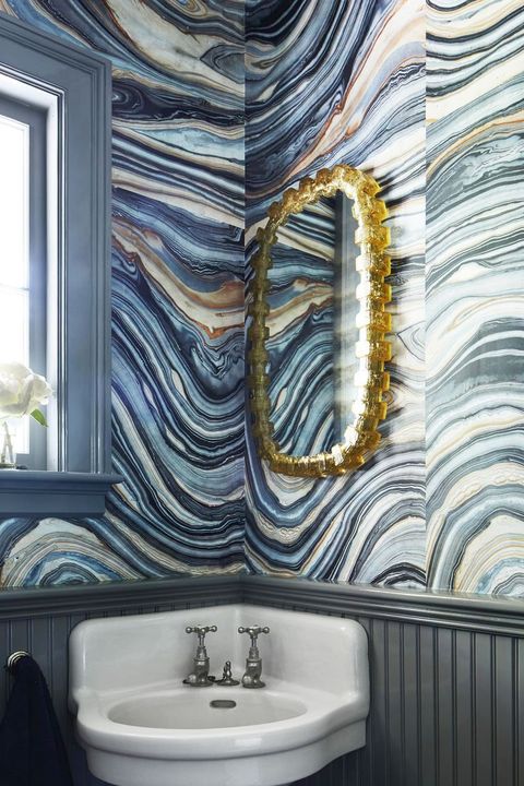small bathroom with blue swirly wallpaper