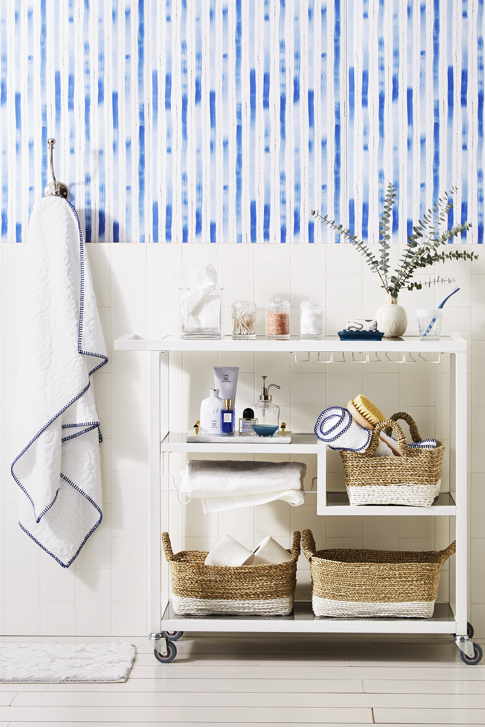 bathroom storage ideas, white bar cart with baskets of toiletries inside