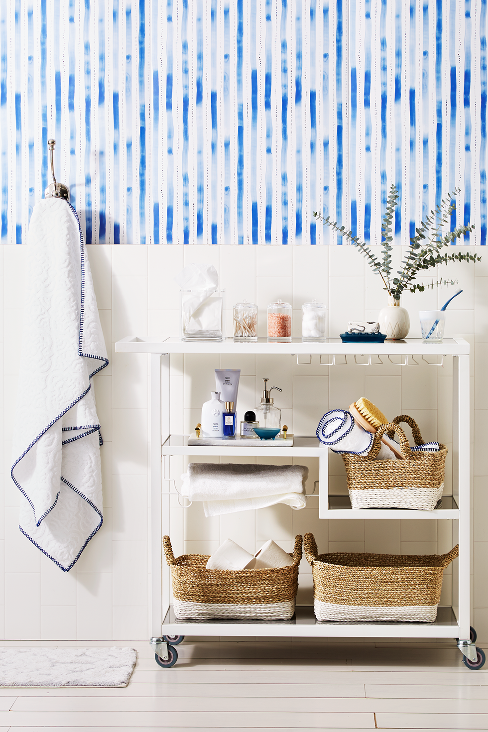 bathroom storage ideas, white bar cart with baskets of toiletries inside