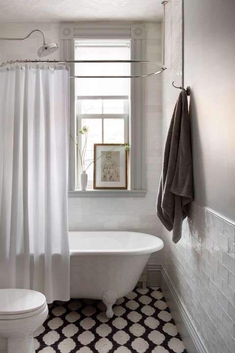 small bathroom with tile and clawfoot tub