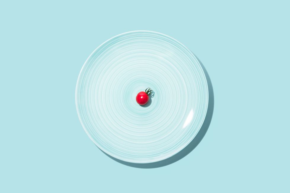 small cherry tomato with big blue plate