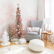 christmas trees clustered together in pink nursery