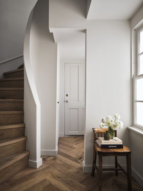 entry way, stairwell of home with dark herringbone floor