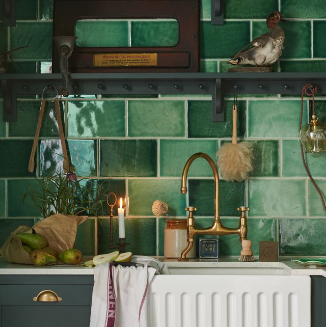 small green kitchen in old cottage is delightfully charming