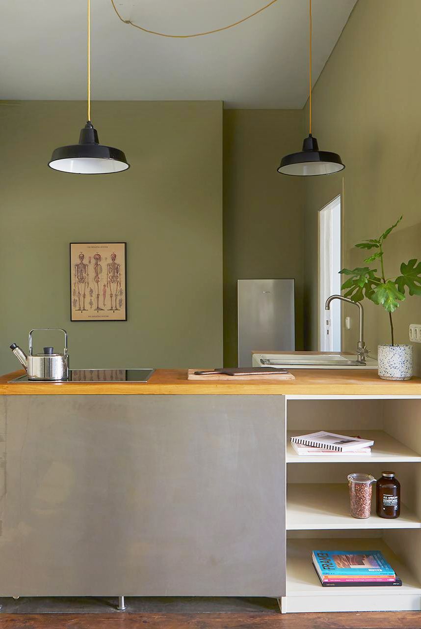 a kitchen with a shelf and a lamp