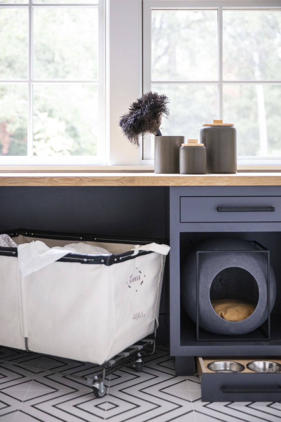 food and water bowl drawer and
orb bed from meyou paris in laundry room designed by emilie munroe
