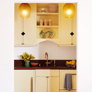 small kitchen with yellow paint