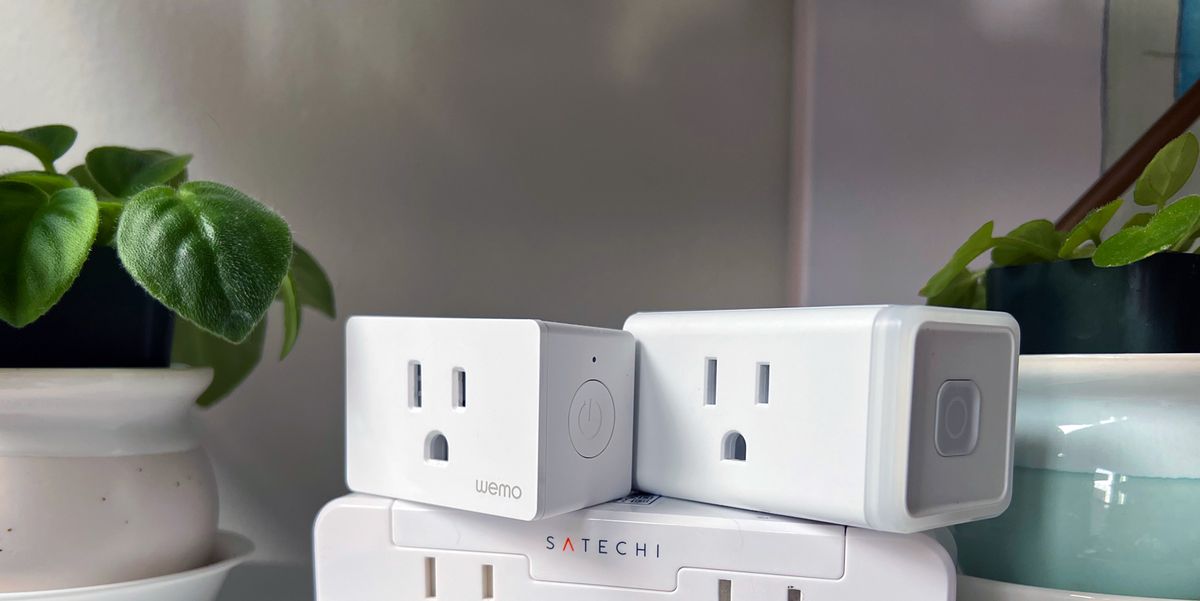 satechi kasa and wemo smart plugs on shelf with plants