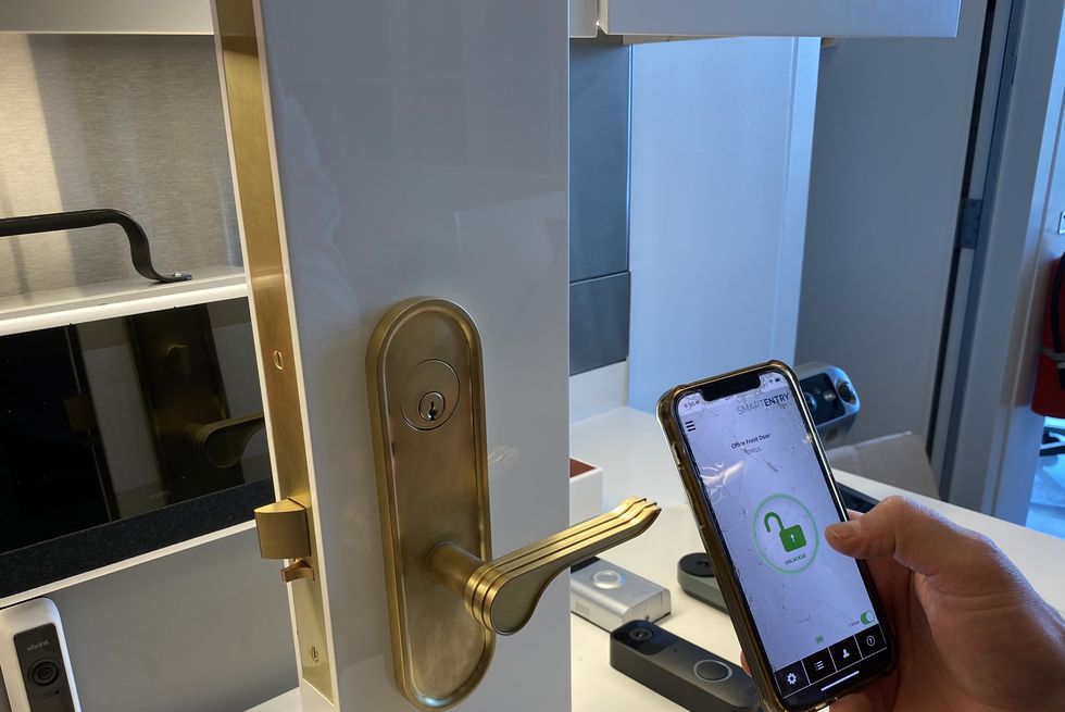 a lab tester evaluates the app feature as part of smart lock testing