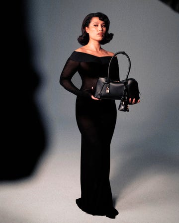 portrait showcasing a stylish figure holding a handbag