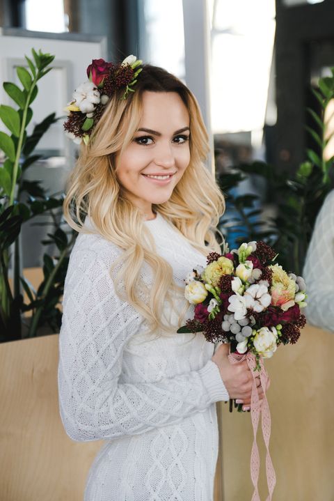 smiling bride with bouquet