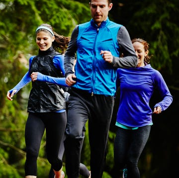 Smiling group of friends running together