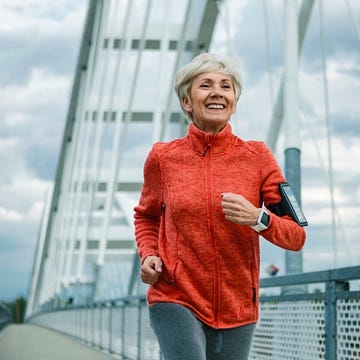 smiling mature woman running