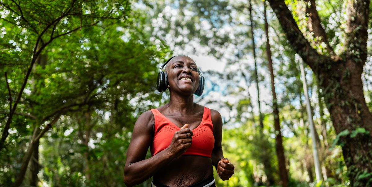 https://hips.hearstapps.com/hmg-prod/images/smiling-mature-woman-with-headphones-running-on-the-royalty-free-image-1755893595.pjpeg?crop=1.00xw:0.751xh;0,0.170xh&resize=1200:*