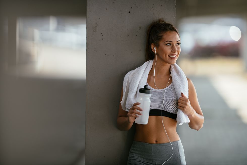 smiling woman resting after workout