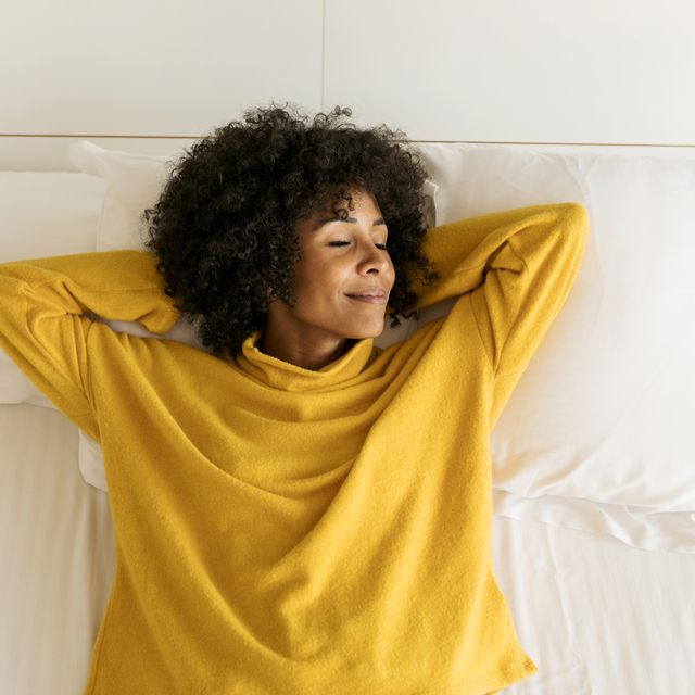 https://hips.hearstapps.com/hmg-prod/images/smiling-woman-with-closed-eyes-lying-on-bed-royalty-free-image-1615928371.?crop=0.607xw:0.911xh;0.139xw,0&resize=640:*
