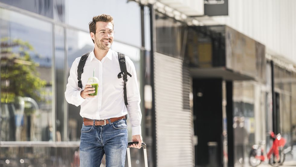 Boy walking with the suitcase in hand
