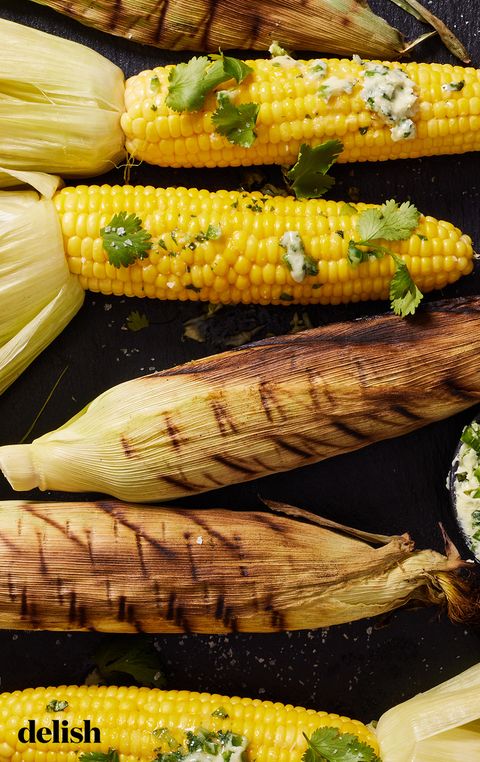 smoked corn on the cob topped with herb butter and cilantro