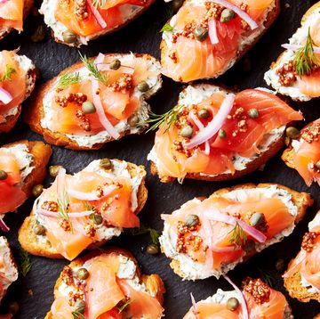 crostini topped with cream cheese, smoked salmon, red onion and capers