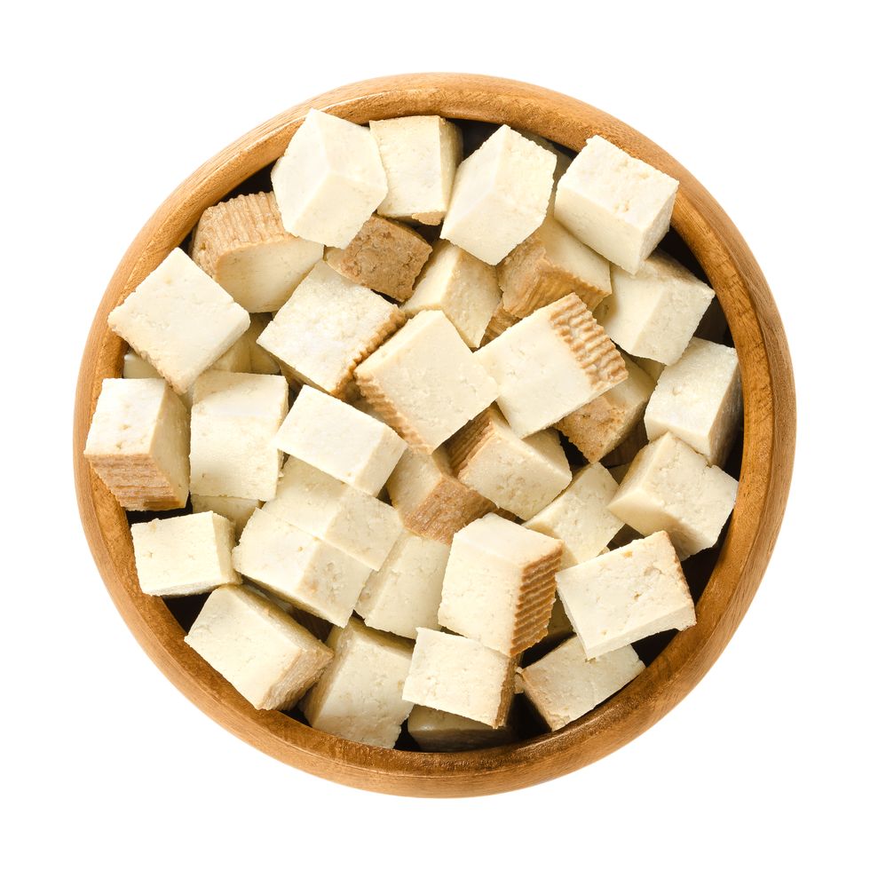 Smoked tofu cubes in wooden bowl