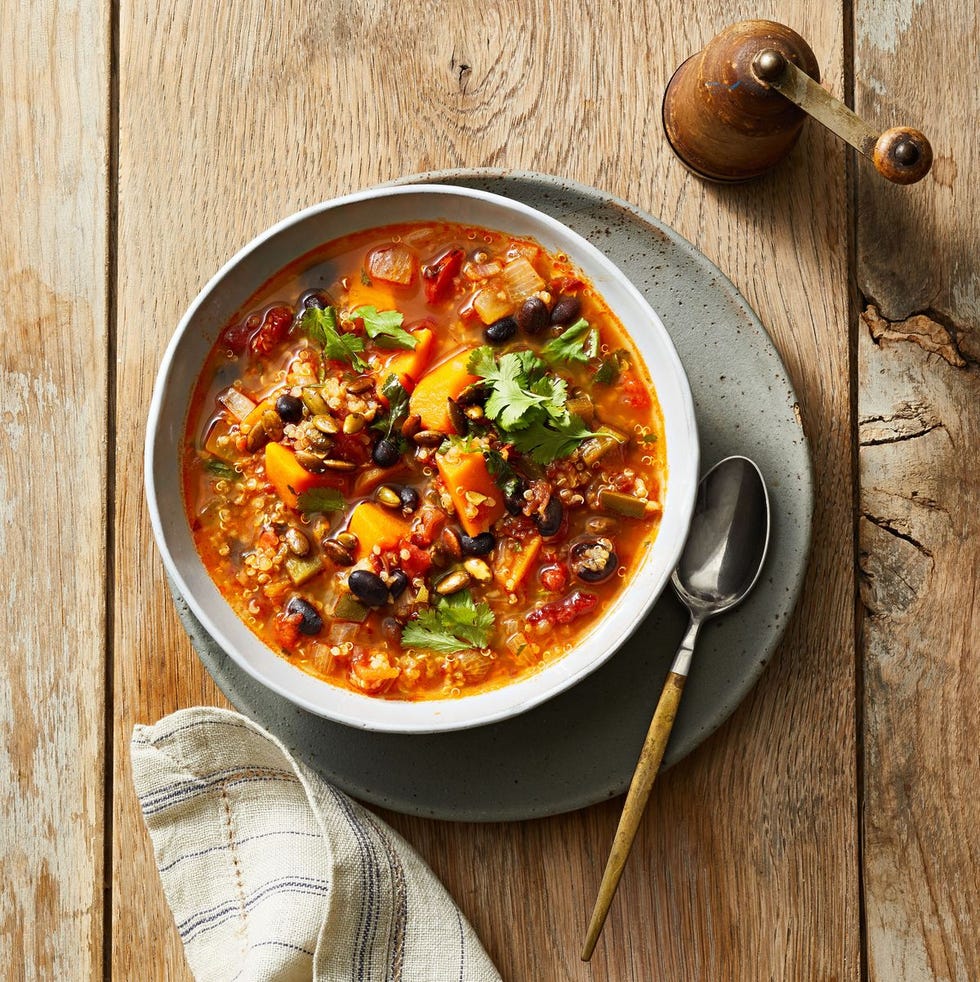 black bean and quinoa soup in a white bowl