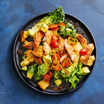 Smoky Chicken Thighs on Baby Romaine chicken thighs over baby romaine salad with avocado, tomatoes, and croutons