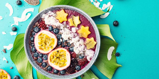 Smoothie Acai Bowl Served In Bowl On Blue Table