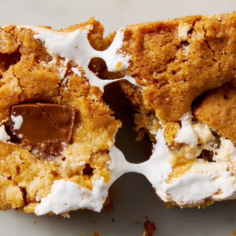 cookie bars filled with s'mores ingredients like chocolate, marshmallow, and graham crackers