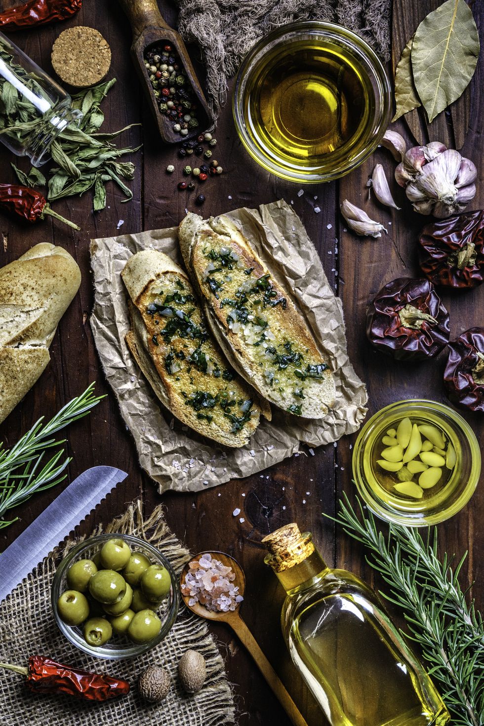 snack or appetizer of garlic basil and olive oil bruschetta on table in a rustic kitchen
