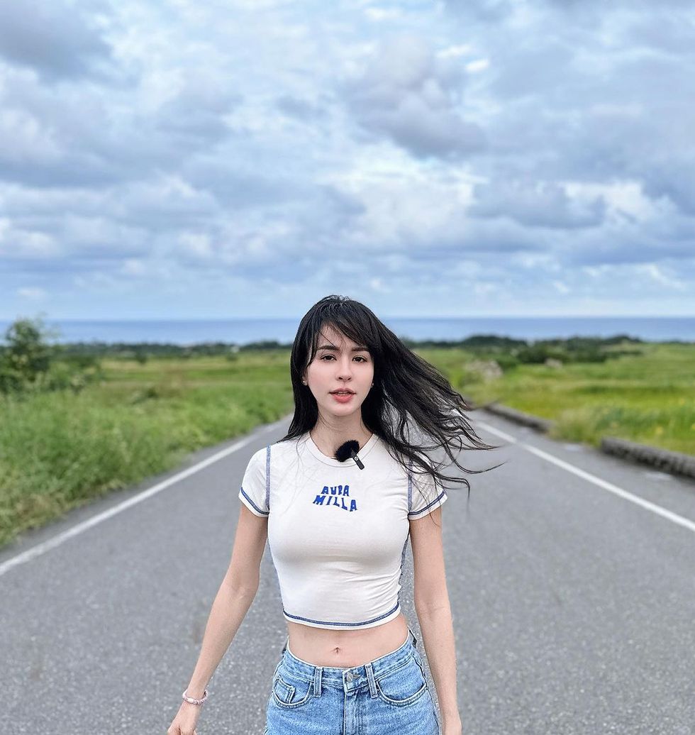 a person standing on a road