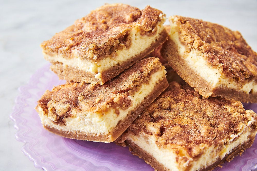 There's A Full Layer Of Cheesecake Stuffed In These Buttery Snickerdoodle Bars