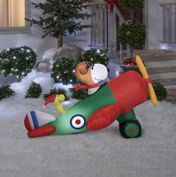 snoopy in an airplane lawn ornament