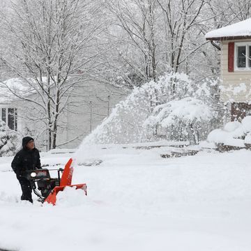 monroe, new york march 14 a view of heavy snowfall while a resident is trying to remove snow out of house entrances in monroe, new york on march 14, 2023 residents trying to remove snow out of house entrances and from the top of their cars photo by lokman vural elibolanadolu agency via getty images