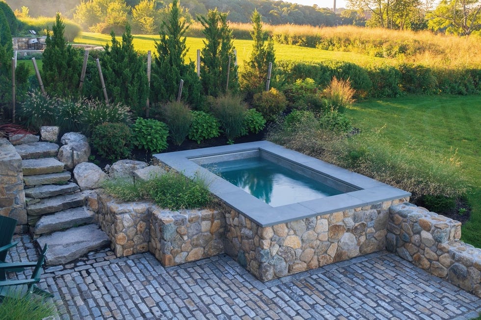 a small pool in a backyard