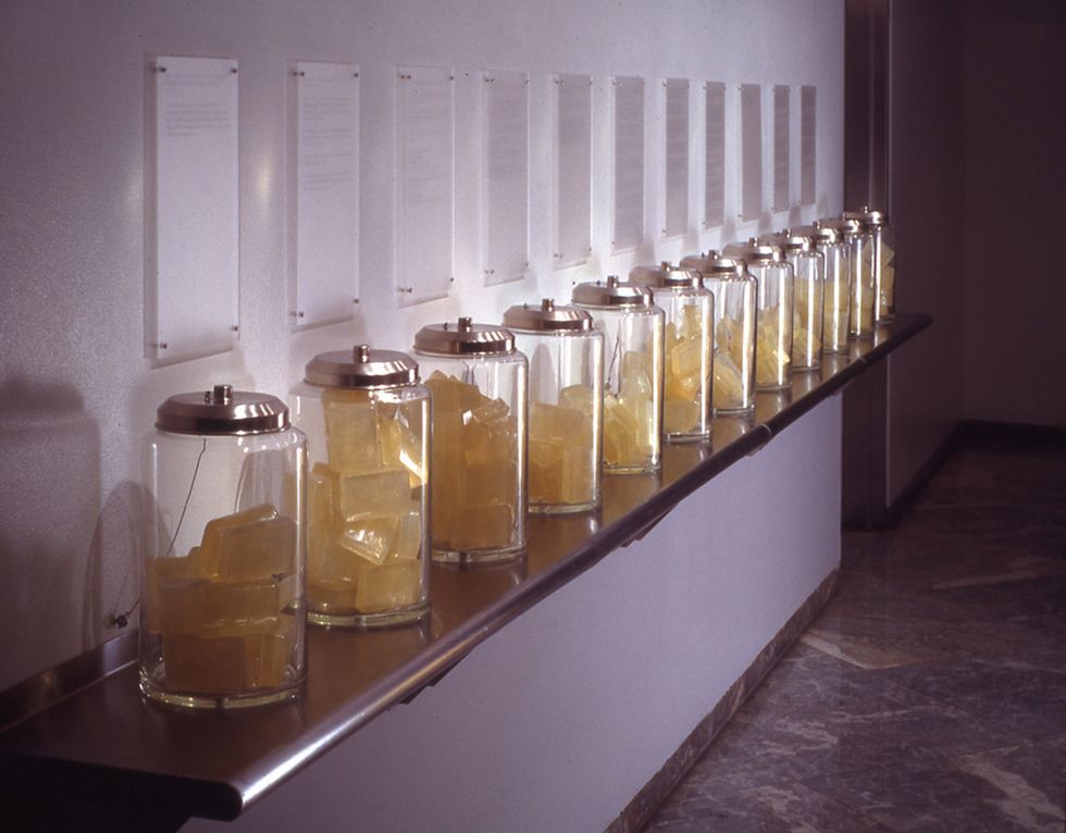 jars of soap bars on a steel shelf