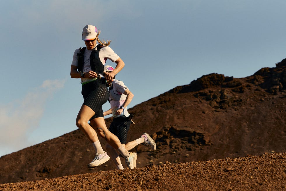two runners on a rugged terrain during an outdoor running event