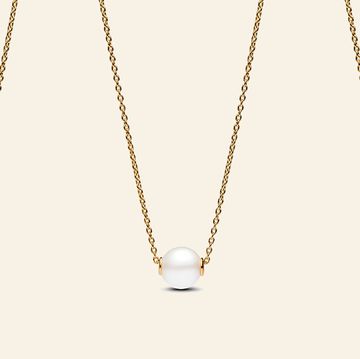 a gold chain with a few white stones