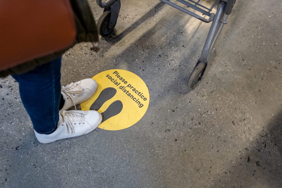 social distance sign on the floor during covid 19